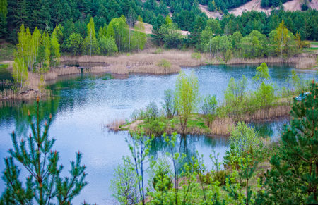 Spring river landscape with water reflectrionの写真素材