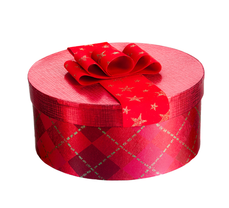 A red christmas present with a red bow. Isolated on a white backgroundの写真素材