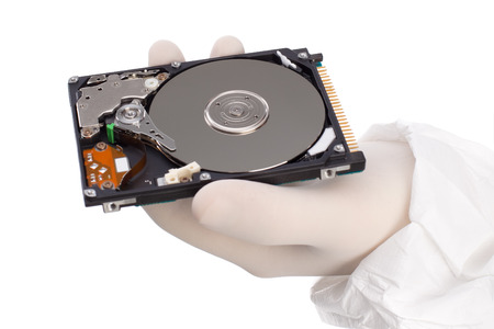 hard drive in hand isolated on white backgroundの写真素材