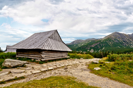 Wooden chalet in high mountainの写真素材