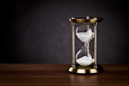 Hourglass on a black background.の写真素材
