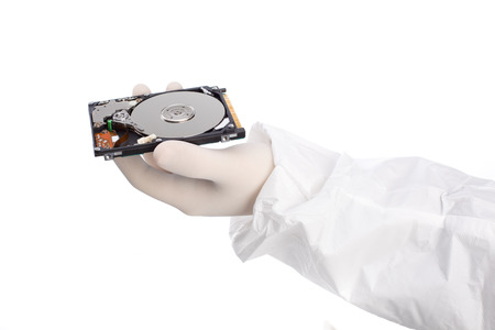 hard disk in hand isolated on white backgroundの写真素材