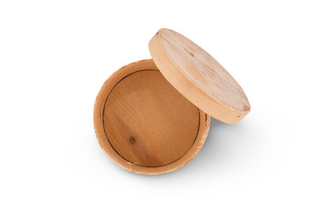 Opened natural wooden round box isolated on white background