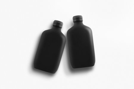 Matte black perfume bottle isolated on white backgroundの写真素材