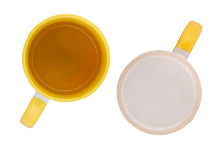 white mug with a yellow handle isolated on white backgroundの写真素材