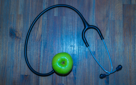 Green apple, stethoscopeの写真素材