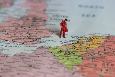 symbol of a worker taking his bags and leaving UK after Brexit,conceptual Map after Uk separation from Europeの写真素材