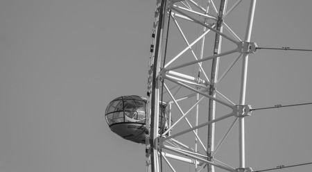 LONDON, UK - October 17th, 2017: Close up of the London Eye in London, England with tourism holding capsule in view, black and white.のeditorial素材