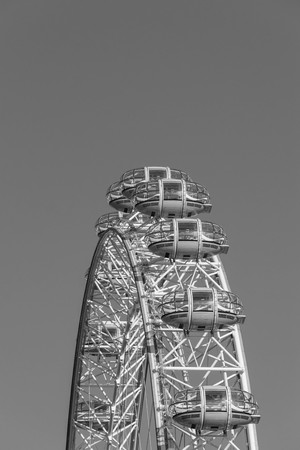 LONDON, UK - October 17th, 2017: Close up of the London Eye in London, England with tourism holding capsule in view, black and white.のeditorial素材