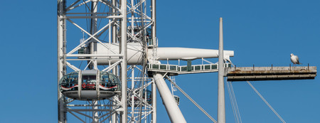 LONDON, UK - October 17th, 2017: Close up of the London Eye in London, England with tourism holding...