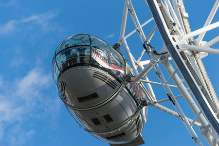 LONDON, UK - October 17th, 2017: Close up of the London Eye in London, England with tourism holding capsule in view.のeditorial素材