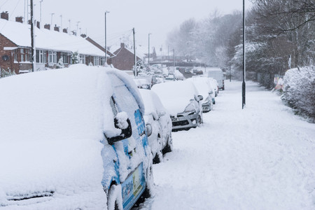 COVENTRY, UNITED KINGDOM 10-12-2017: heavy snowfall, cars covered by snow and traffic affected.のeditorial素材