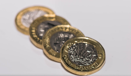 Close up focus photos of new United kingdom Pound coin isolated on a white backgroundの写真素材