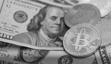 Bitcoins with US banknotes, golden bitcoin, silver bitcoin, bronze bitcoinの写真素材