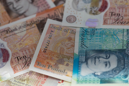 British bancknotes close up, including 5 pounds note, 10 pounds notes, 20 pounds sterling notes.の写真素材