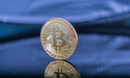 Extreme close up of Golden Bitcoin Coin Bitcoin cryptocurrency. Business concept.の写真素材