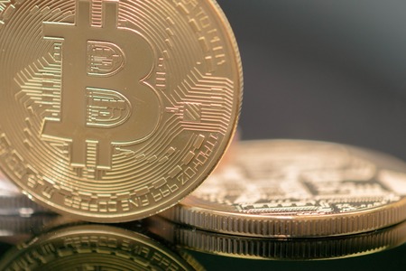 Extreme close up of Golden Bitcoin Coin Bitcoin cryptocurrency. Business concept.の写真素材