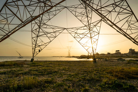 Electric energy transmission by high voltage power lines.