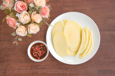 slice mango with sauce on the tableの写真素材