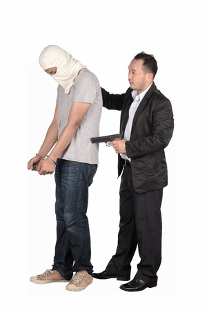 He was arrested for theft and fraudの写真素材