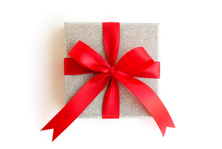 Silver gift box with red ribbon on white background with clipping path included