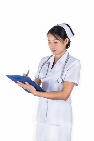 nurse in uniform writing paper on white background, healthcare and medical conceptの写真素材