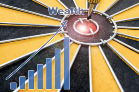 Closeup Wealth Dart target on bullseye with wealth graph, Success business concept, abstract backgroundの写真素材