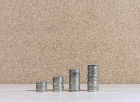 stair to wealth made from coins stacked increasing on wooden table with copy space, business success...