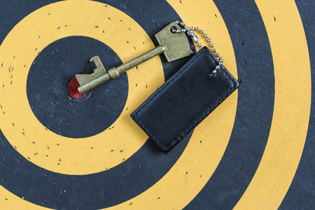 old key to success concept with blank tag over red target on dartboardの写真素材