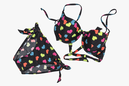 fashion swimsuit colorful heart on black bikini isolated over white background included clipping pathの写真素材