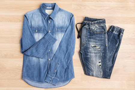 Jeans denim fashion casual clothing on wooden table, top viewの写真素材