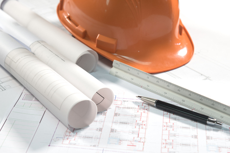architectural plans project drawing and pen with blueprints rollsの写真素材