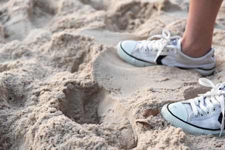 shoes on tropical sand beach texture background with copy space の写真素材