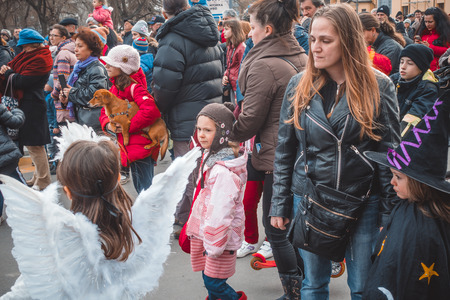 Varna, Bulgaria, March 26, 2016: Thousands of citizens of any age put on their festive carnival...