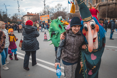 Varna, Bulgaria, March 26, 2016: Varna citizens making photos with theatrical and folk costumed participants of the annual Spring Carnival.のeditorial素材