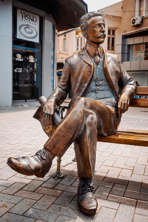 A bronze sculpture - made by artist Veselin Kostadinov - features the famouse bulgarian 
architect sitting in a relaxed pose on a street bench and looking at Hotel Musala - one 
of the more than 200 beautiful historical buldings created by Dabko Dabkov prのeditorial素材