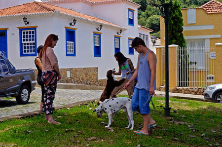 Sao Joao del Rei, Minas Gerais, Brazil - January 25, 2020: People with your dogs in the public square.のeditorial素材