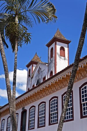 Colonial facade and towers church on the background, Serro, Minas Gerais, Brazilの写真素材