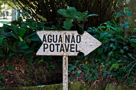Rio de Janeiro, Brazil - February 8, 2020: Information board that says: non-drinking water.のeditorial素材