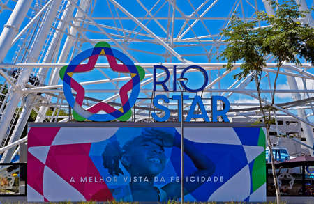 Rio de Janeiro, Brazil - December 30, 2019: Rio Star logo, ferris wheel at port area.のeditorial素材