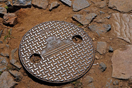 Tiradentes, Minas Gerais, Brazil - September 7, 2018: Manhole cover on typical street.のeditorial素材