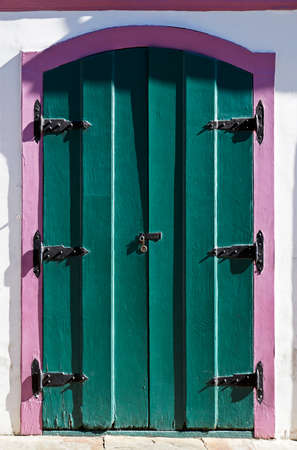 Ancient colonial door at historical city of Ouro Preto, Brazilの写真素材