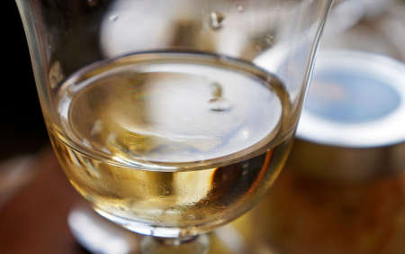 White wine glass on tableの写真素材