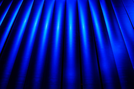 Blue striped background with light