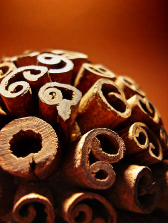 Cinnamon sticks on brown background