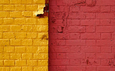 Yellow and red brick wall backgroundの写真素材