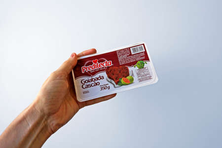 Rio de Janeiro, Brazil - March 18, 2021: Traditional Guava Smudge on hand (Brazilian brand)のeditorial素材