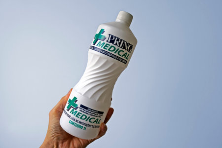Rio de Janeiro, Brazil - April 17, 2021: One liter of 70% liquid alcohol on hand. Brazilian brand (Pring).のeditorial素材