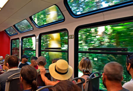 Rio de Janeiro, Brazil - March 16, 2022: Tourists inside the train to Corcovado Mountainのeditorial素材