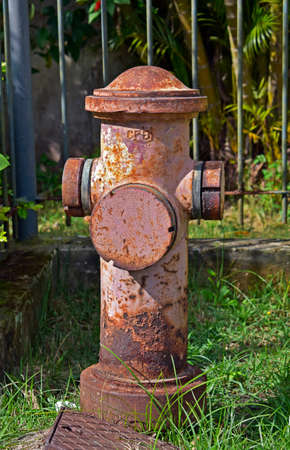Old fire hydrant next to the sidewalk of a residential condominium, Rioの写真素材